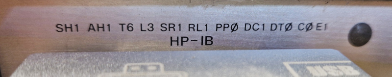 Example GPIB/HP-IB capability code label reading SH1 AH1 T6 L3 SR1 RL1 PP0 DC1 DT0 C0 E1